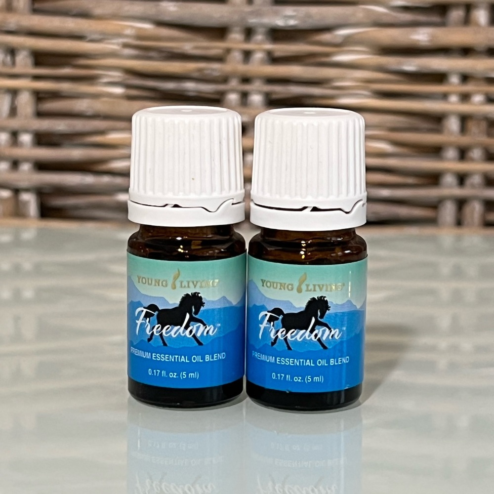 TWO bottles of UNOPENED Young Living Freedom Essential Oil Blend.